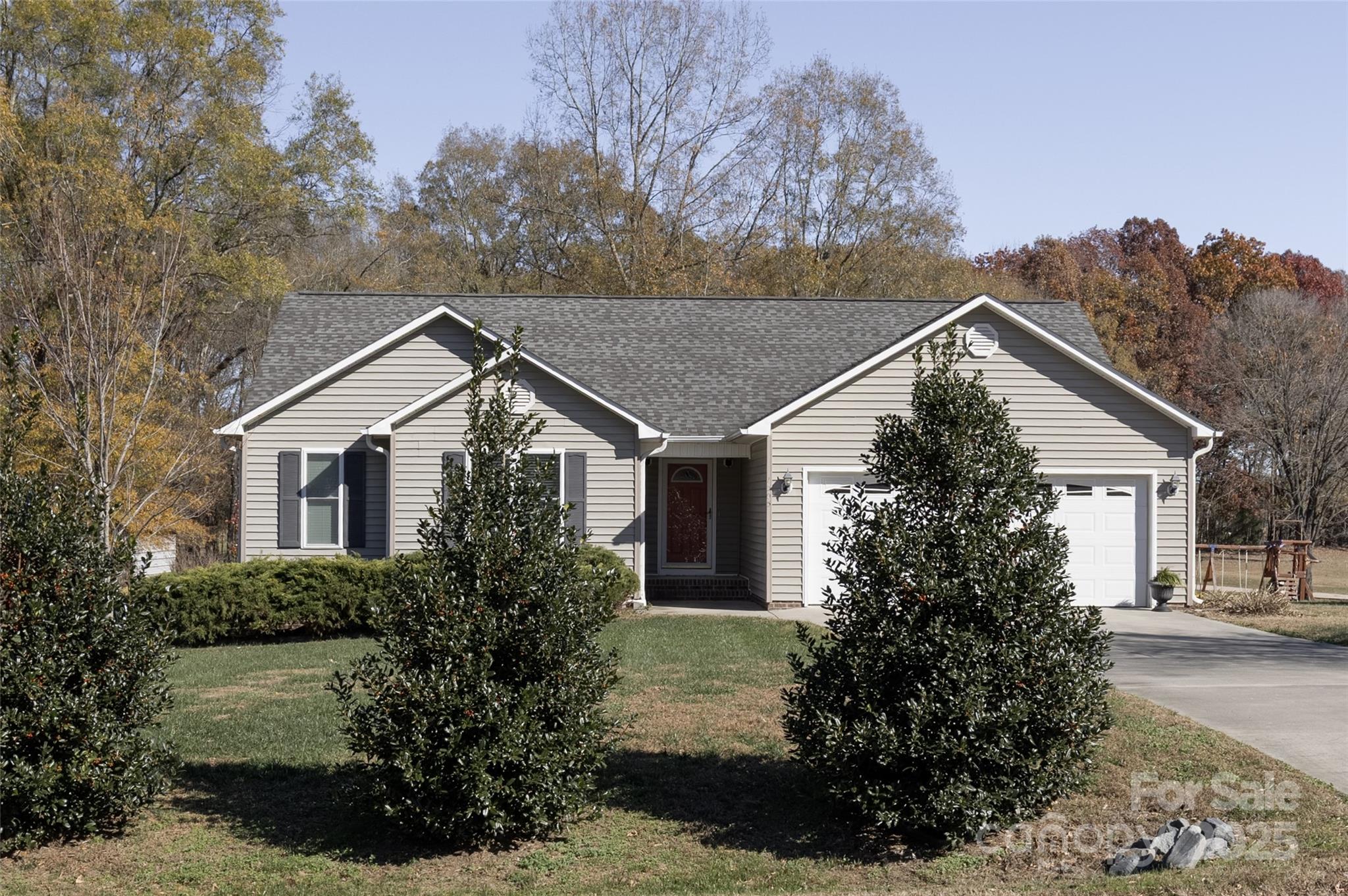 1505 Moss Springs Road Albemarle, NC 28001 - Photo 26 of 26 a house with trees in the background