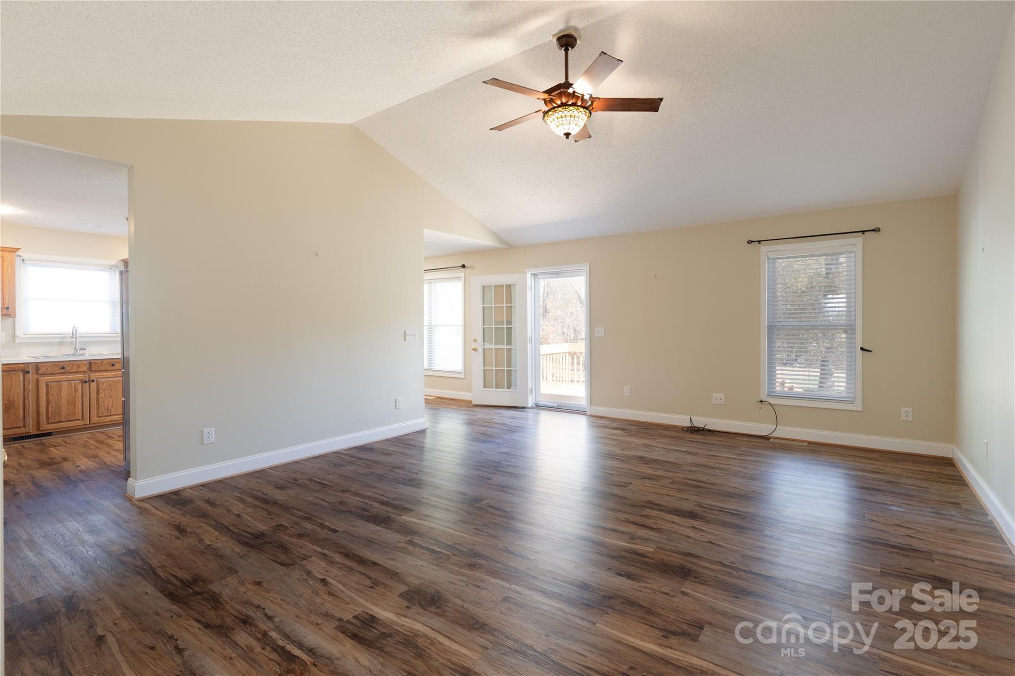 1505 Moss Springs Road Albemarle, NC 28001 - Photo 3 of 26 a view of an empty room with wooden floor and a window