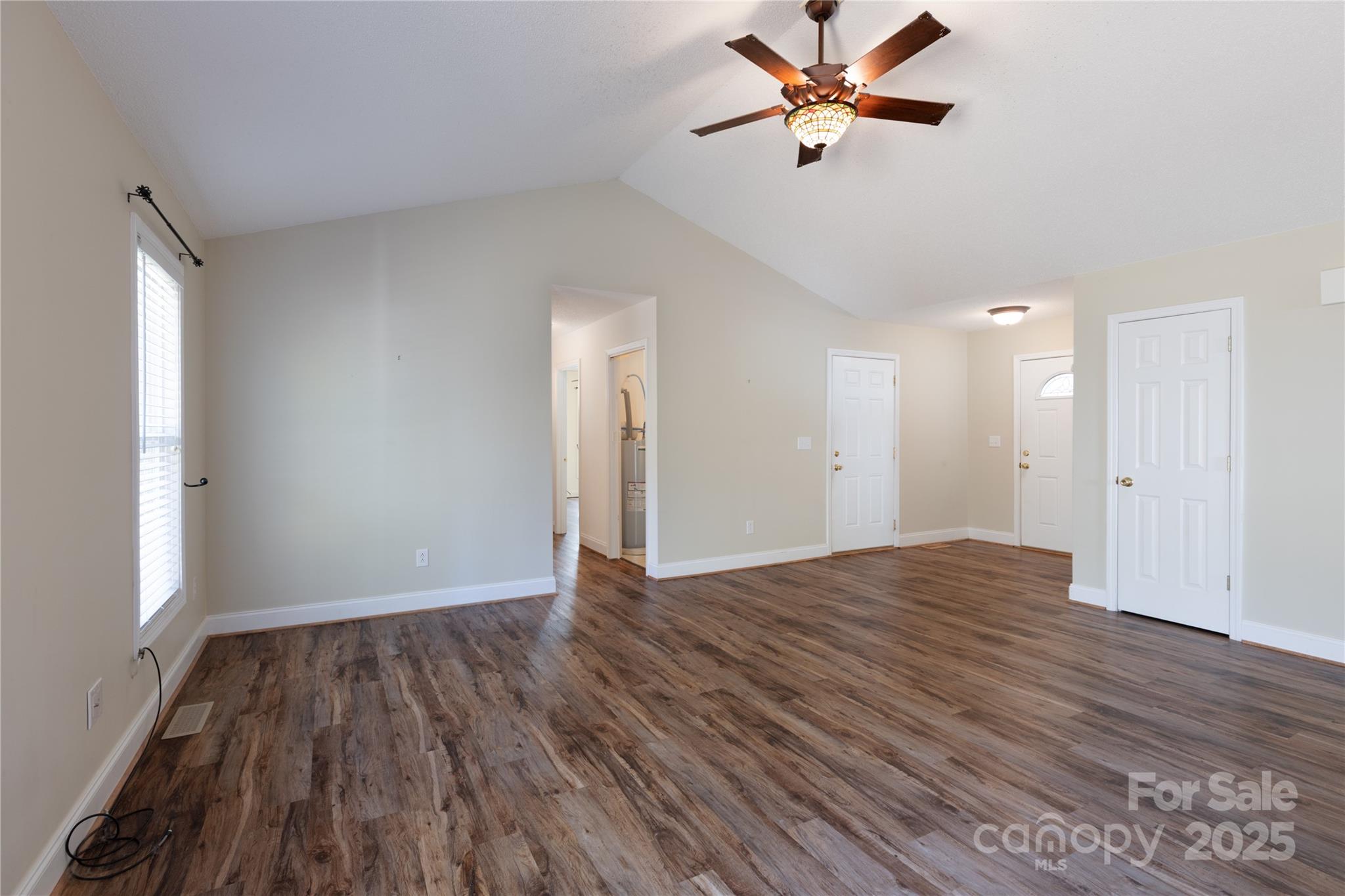 1505 Moss Springs Road Albemarle, NC 28001 - Photo 4 of 26 wooden floor in an empty room with a window