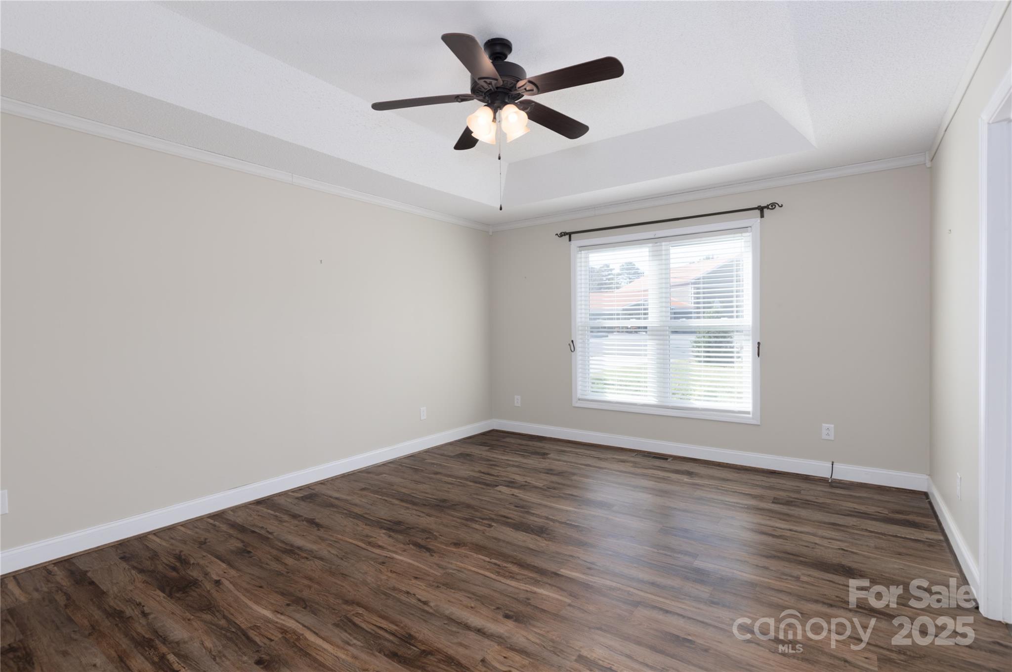 1505 Moss Springs Road Albemarle, NC 28001 - Photo 8 of 26 wooden floor in an empty room with a window