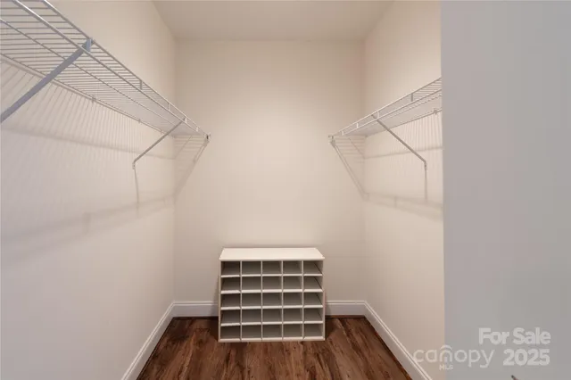 a view of room with wooden floor and window