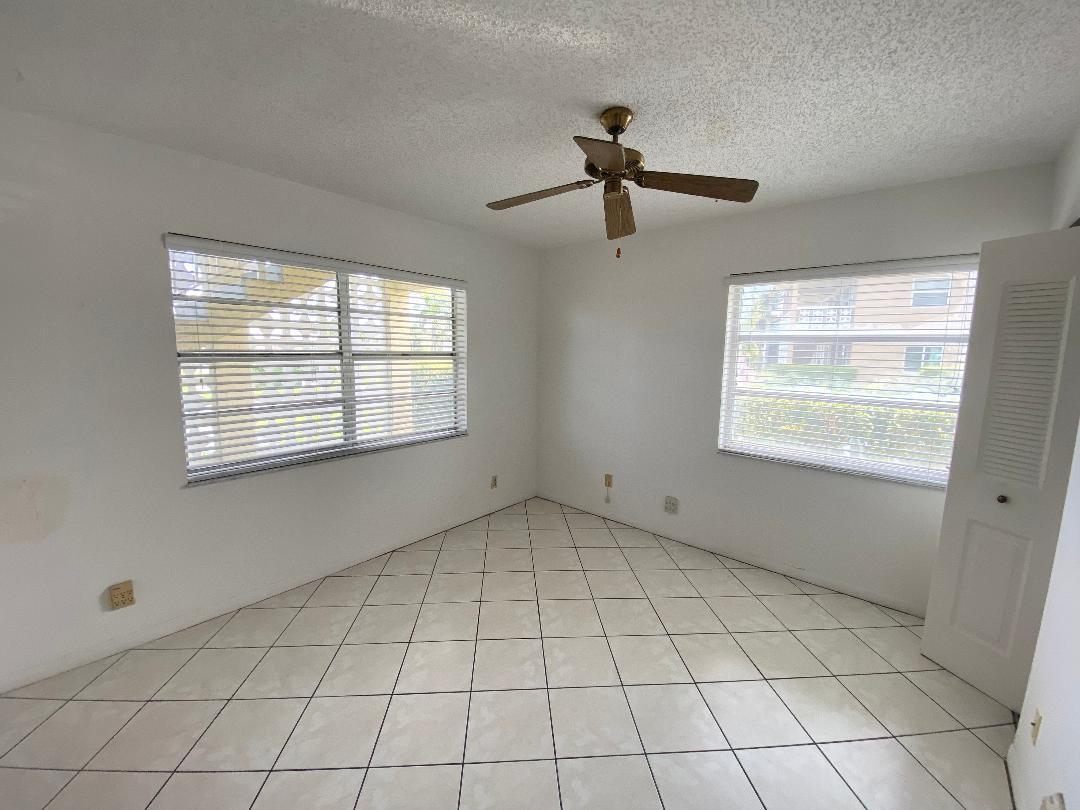 1141 Violet Terrace, Unit 101 Delray Beach, FL 33445 - Photo 13 of 29 a view of an empty room with a window