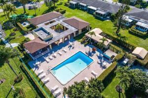 1141 Violet Terrace, Unit 101 Delray Beach, FL 33445 - Photo 17 of 29 an aerial view of a house with a garden