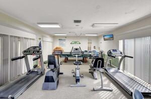 1141 Violet Terrace, Unit 101 Delray Beach, FL 33445 - Photo 19 of 29 a view of a room with gym equipment