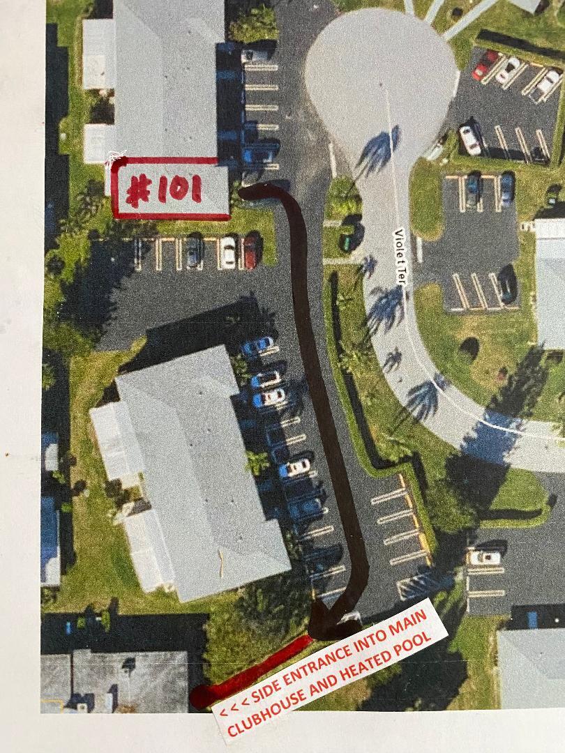 1141 Violet Terrace, Unit 101 Delray Beach, FL 33445 - Photo 3 of 29 an aerial view of a residential apartment building with entryway