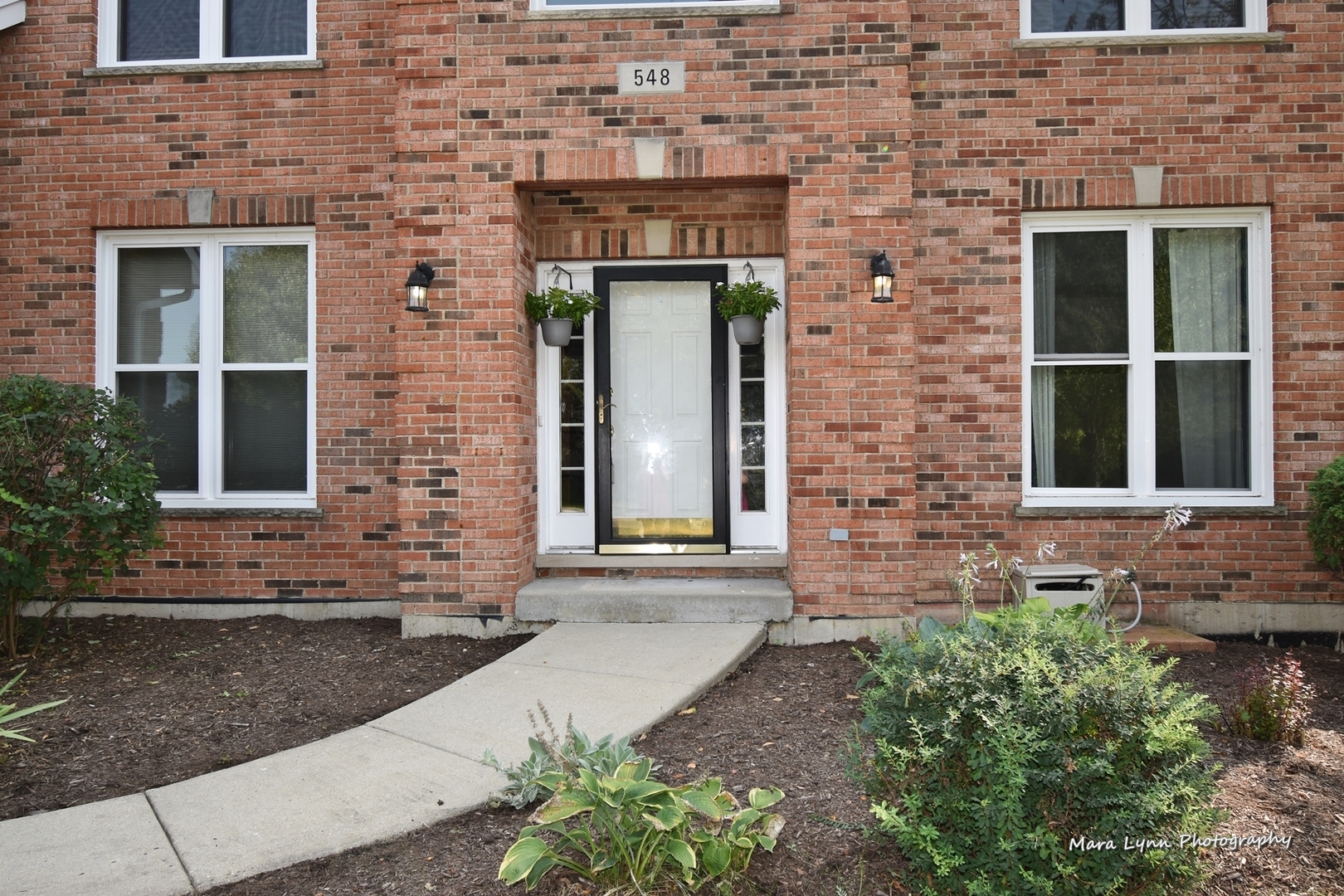 548 Lewis Road Geneva, IL 60134 - Photo 2 of 47 a front view of a house with a yard