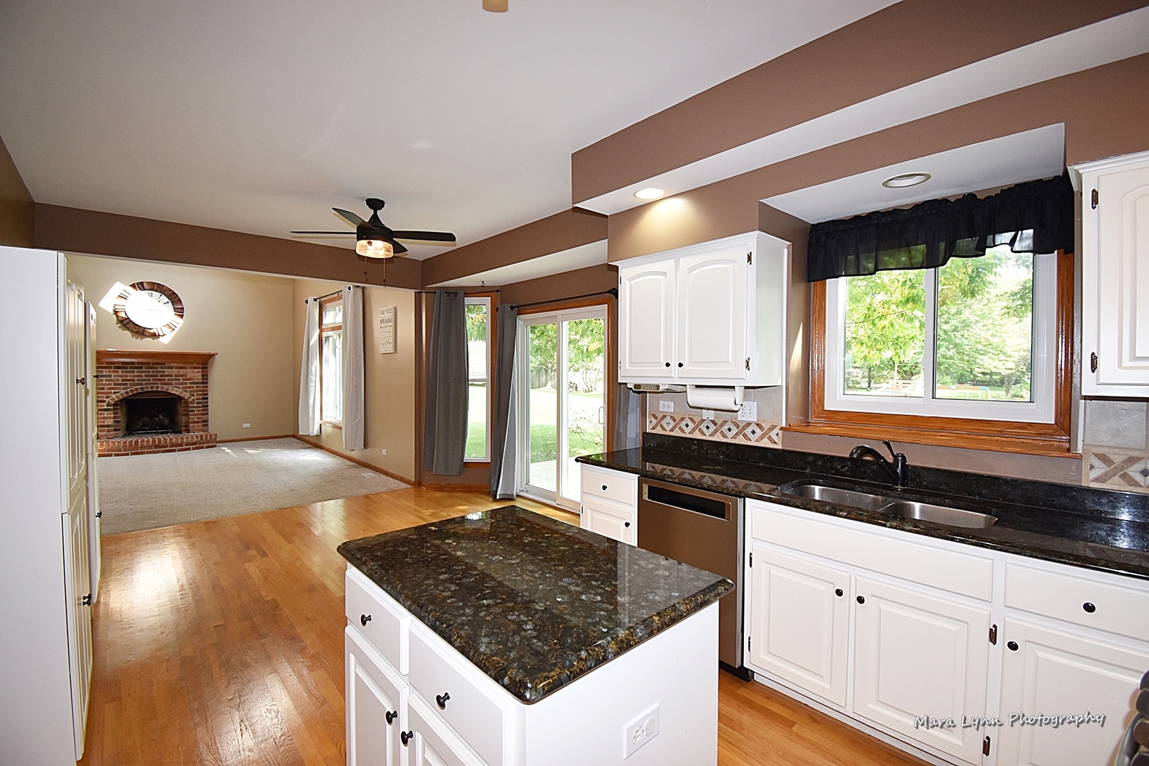 548 Lewis Road Geneva, IL 60134 - Photo 14 of 47 a kitchen with a sink stove and cabinets