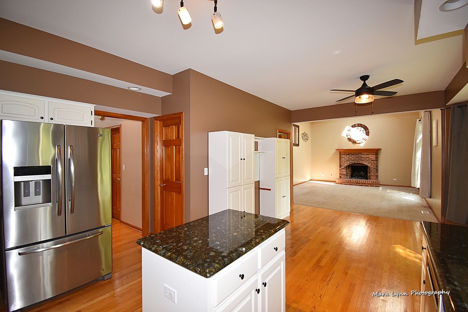 548 Lewis Road Geneva, IL 60134 - Photo 16 of 47 a kitchen with stainless steel appliances granite countertop a sink a refrigerator and a stove