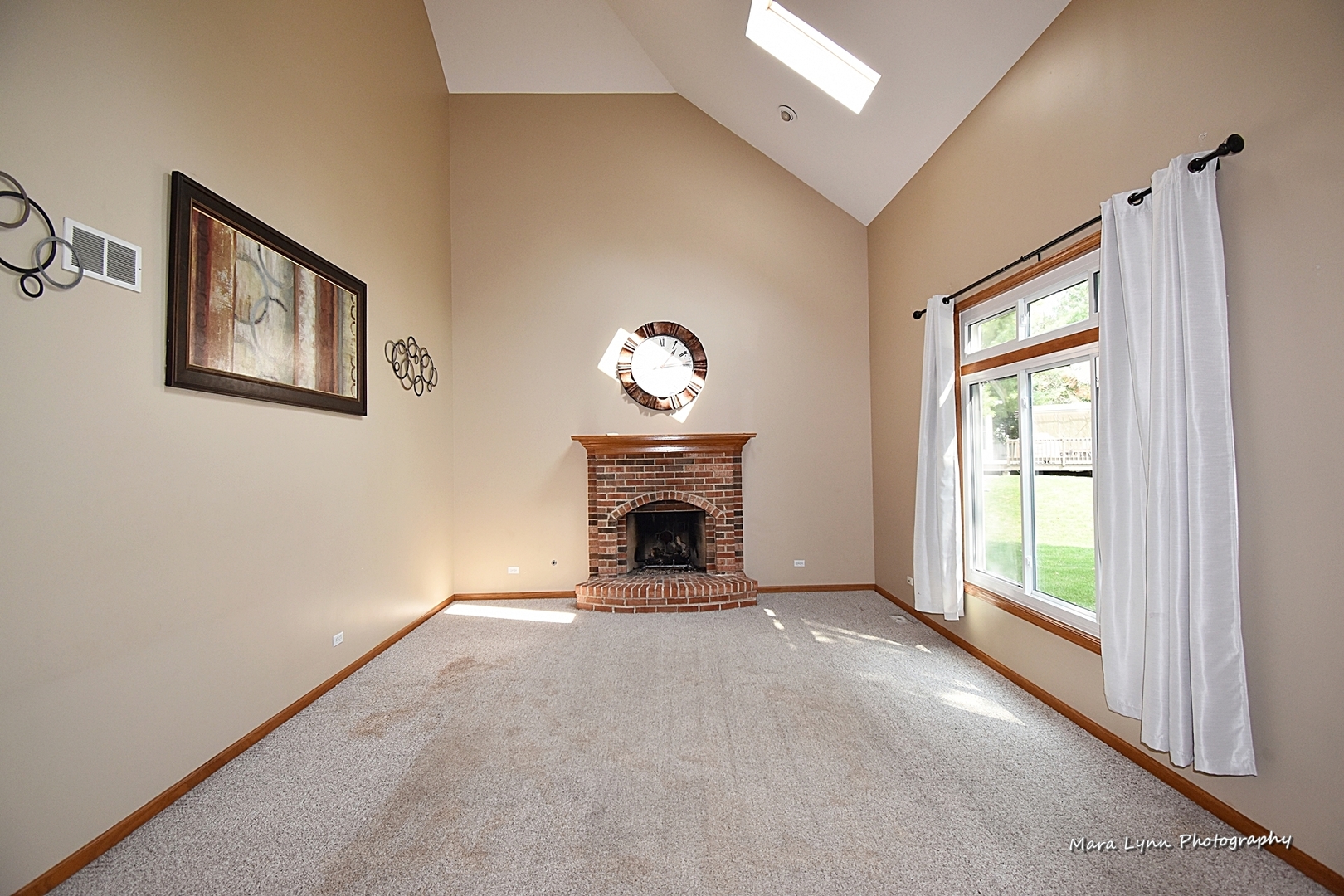 548 Lewis Road Geneva, IL 60134 - Photo 18 of 47 a view of an empty room with a window and fireplace