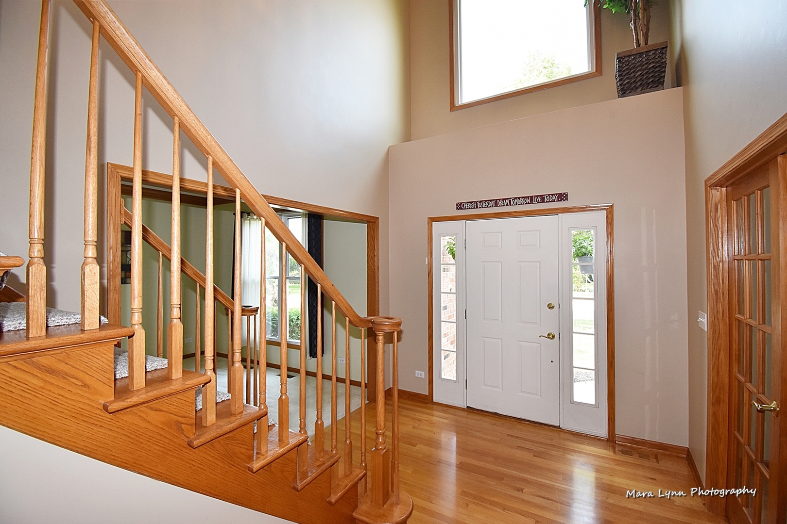 548 Lewis Road Geneva, IL 60134 - Photo 3 of 47 a view of an entryway with wooden floor and door
