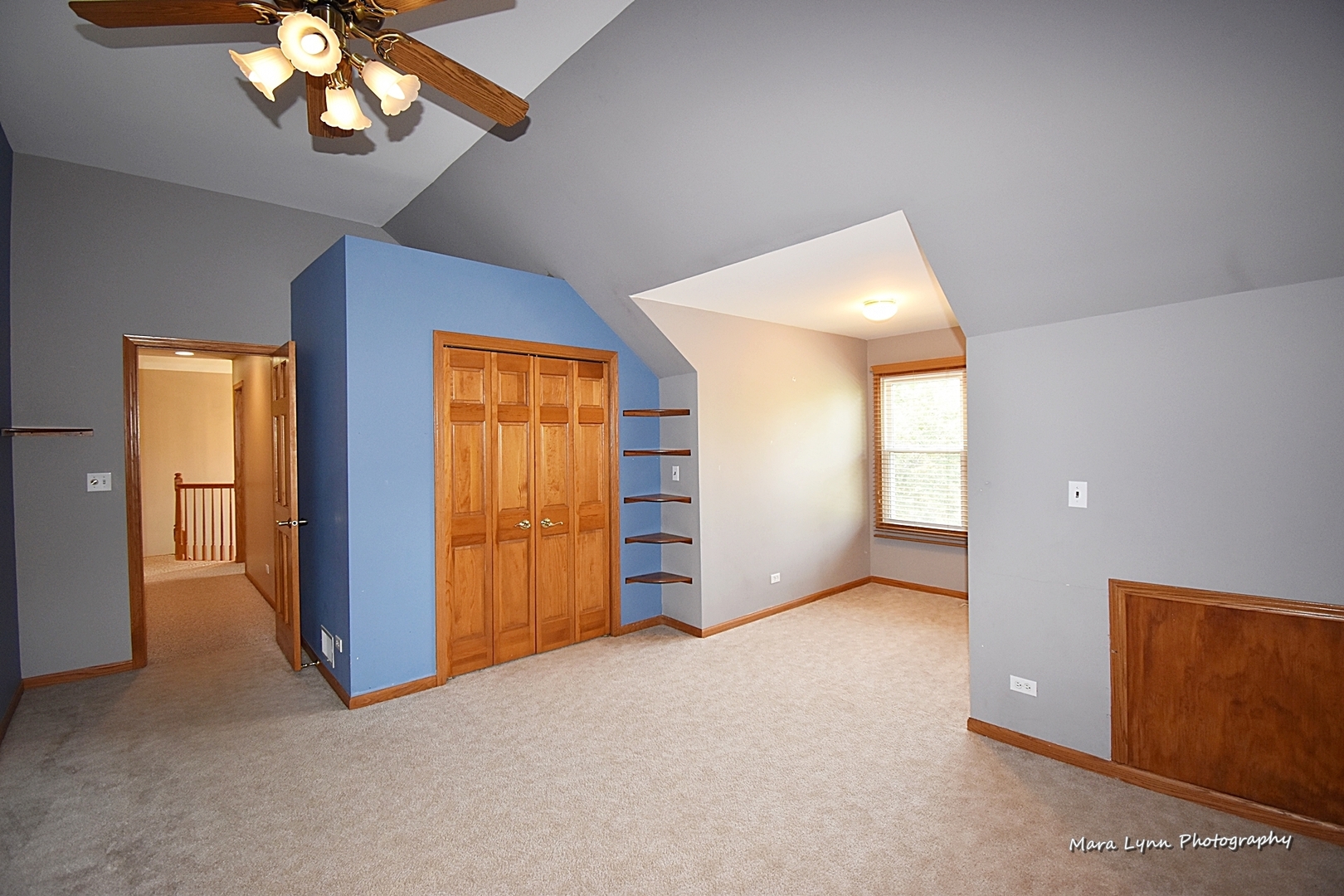 548 Lewis Road Geneva, IL 60134 - Photo 32 of 47 an empty room with windows and chandelier fan