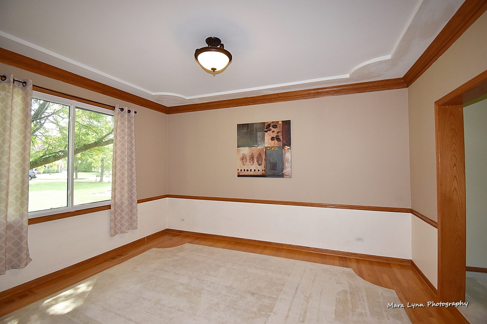 548 Lewis Road Geneva, IL 60134 - Photo 10 of 47 a view of a room with window and wooden floor
