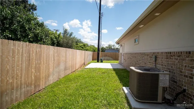 a view of a backyard with jacuzzi