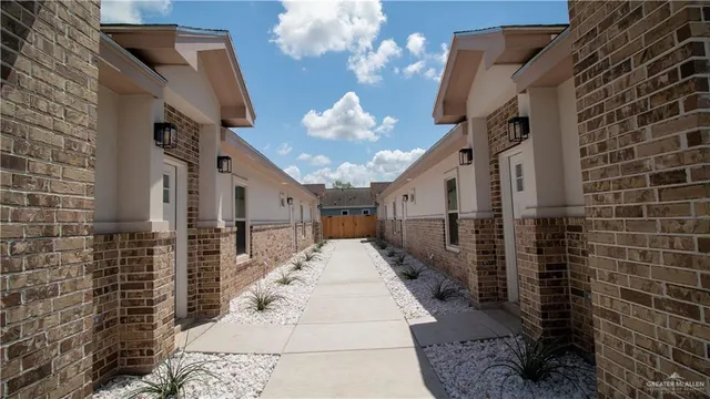 a view of a brick house with a large windows