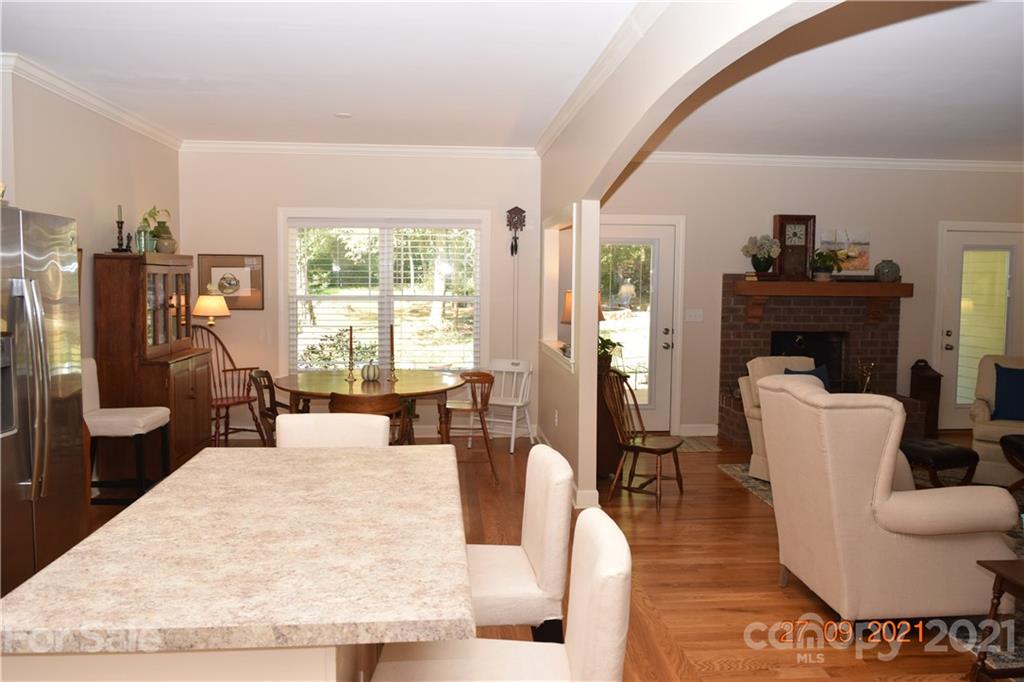 160 Kent Road Salisbury, NC 28147 - Photo 12 of 27 a living room with furniture a large window and wooden floor