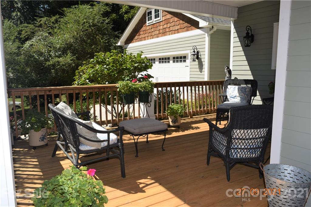 160 Kent Road Salisbury, NC 28147 - Photo 4 of 27 a balcony with wooden floor table and chairs