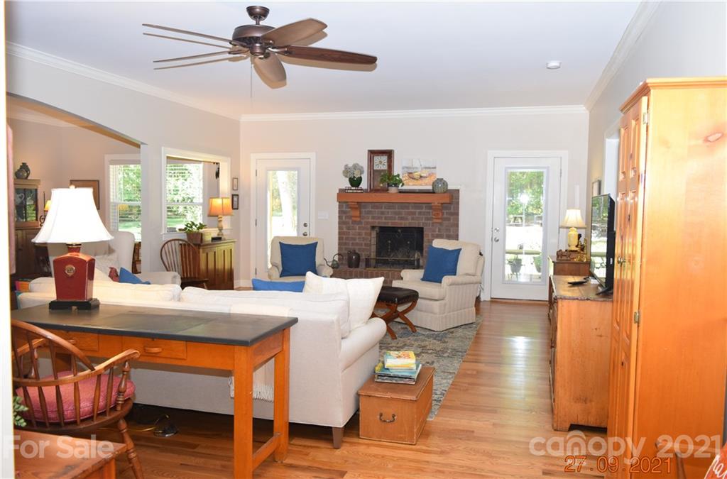 160 Kent Road Salisbury, NC 28147 - Photo 8 of 27 a living room with patio furniture and a fireplace