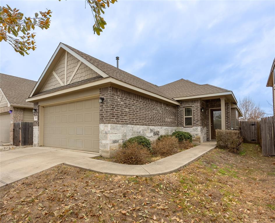 615 Stampede Road San Marcos, TX 78666 - Photo 1 of 26 A classic brick and stone facade offers welcoming curb appeal.