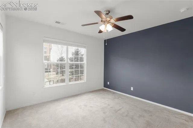 a bedroom with bed and a window