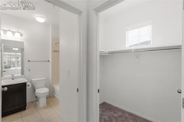 a bathroom with a sink toilet a mirror and shower