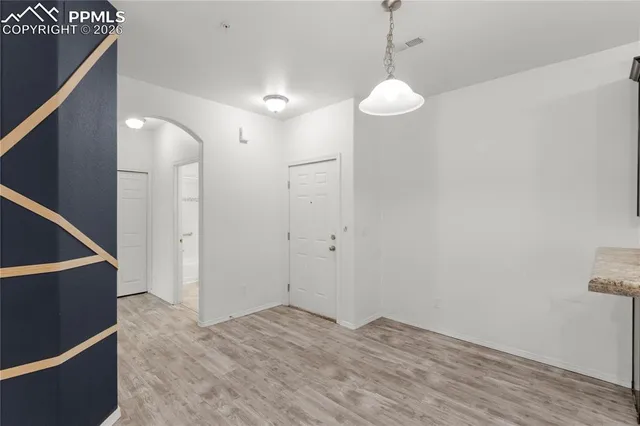 a bathroom with a toilet sink vanity and mirror