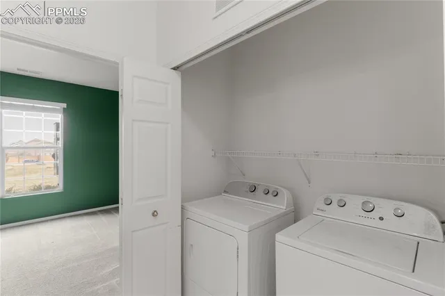 a view of a room that has a window in it