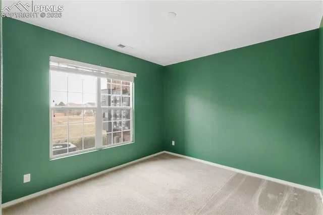 a workspace with furniture and a window