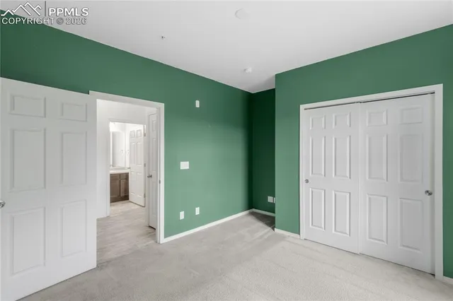 a view of a room that has a large window