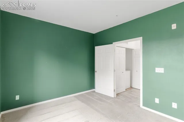 a view of a balcony with wooden fence and floor