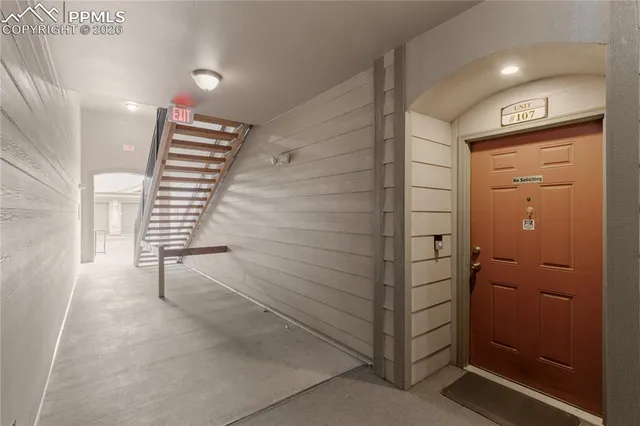 a view of a kitchen with cabinets and wooden floor