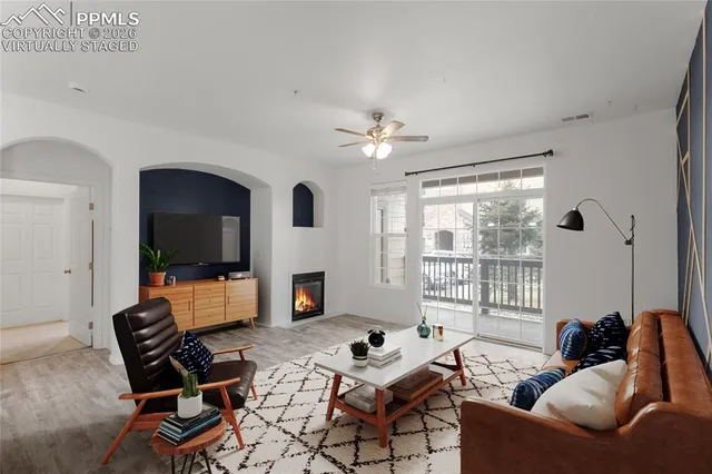 a view of a kitchen with a sink and a refrigerator