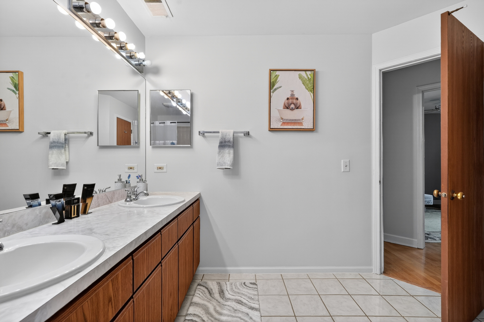 943 Ridgefield Lane, Unit 4 Wheeling, IL 60090 - Photo 14 of 38 a spacious bathroom with a double vanity sink and a mirror