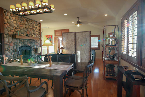 1050 Spring Road Shelter Cove, CA 95589 - Photo 19 of 42 a view of a dining room with furniture and chandelier