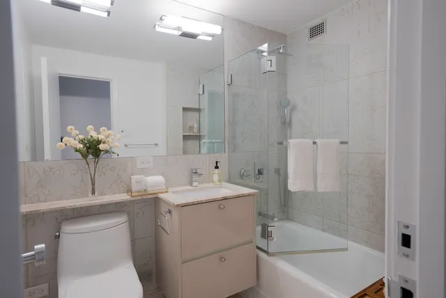 a bedroom with a bed chair and window