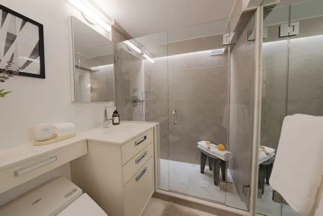 a bedroom with bed couch and window