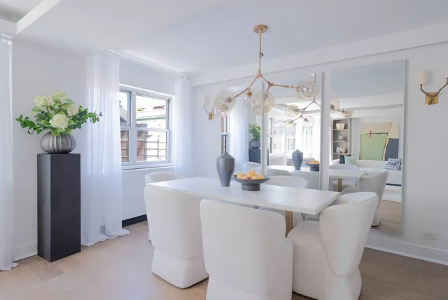 a kitchen with stainless steel appliances a sink stove and cabinets