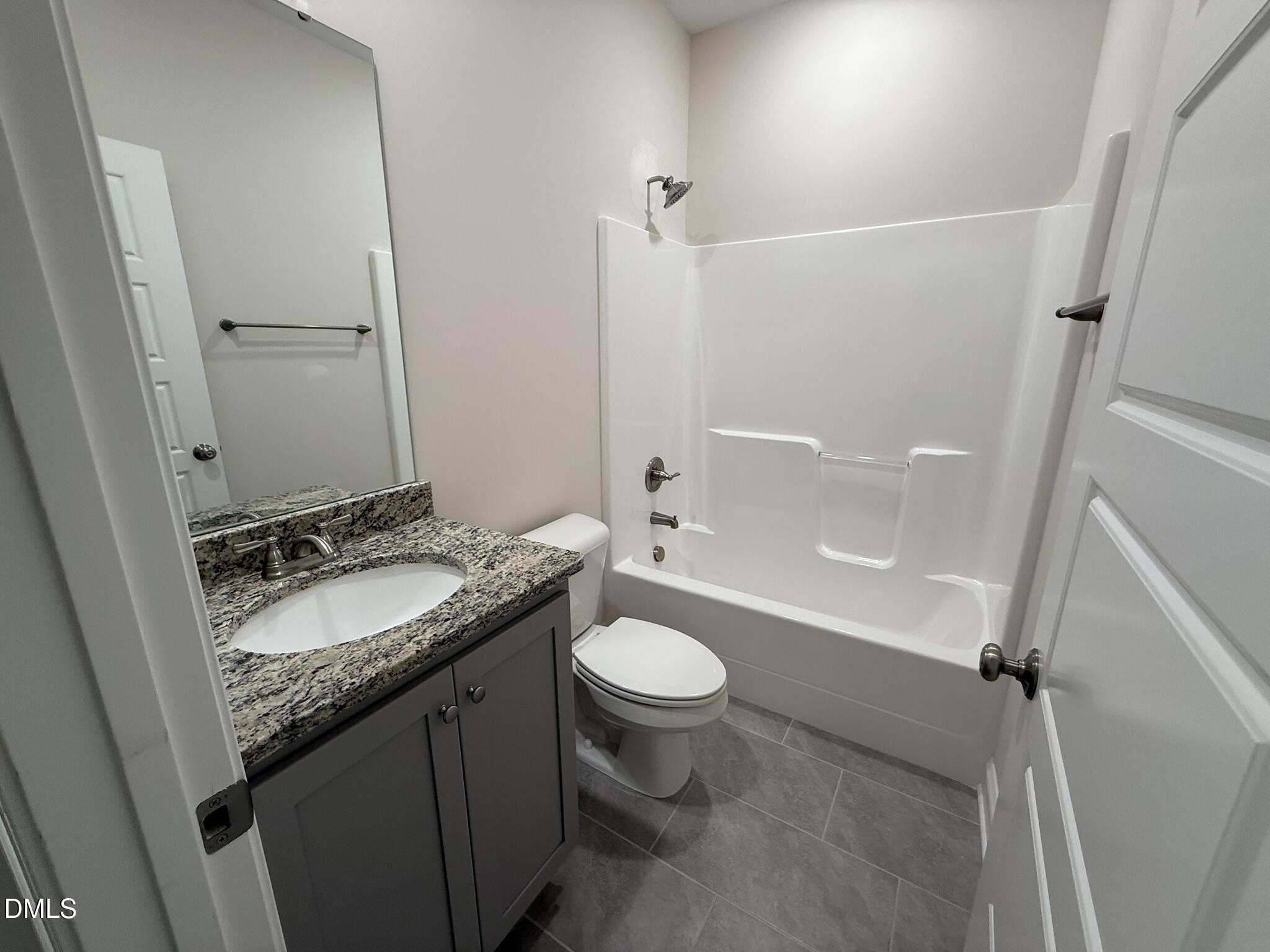 309 Busterfield Court Benson, NC 27504 - Photo 20 of 27 a bathroom with a granite countertop sink toilet and shower