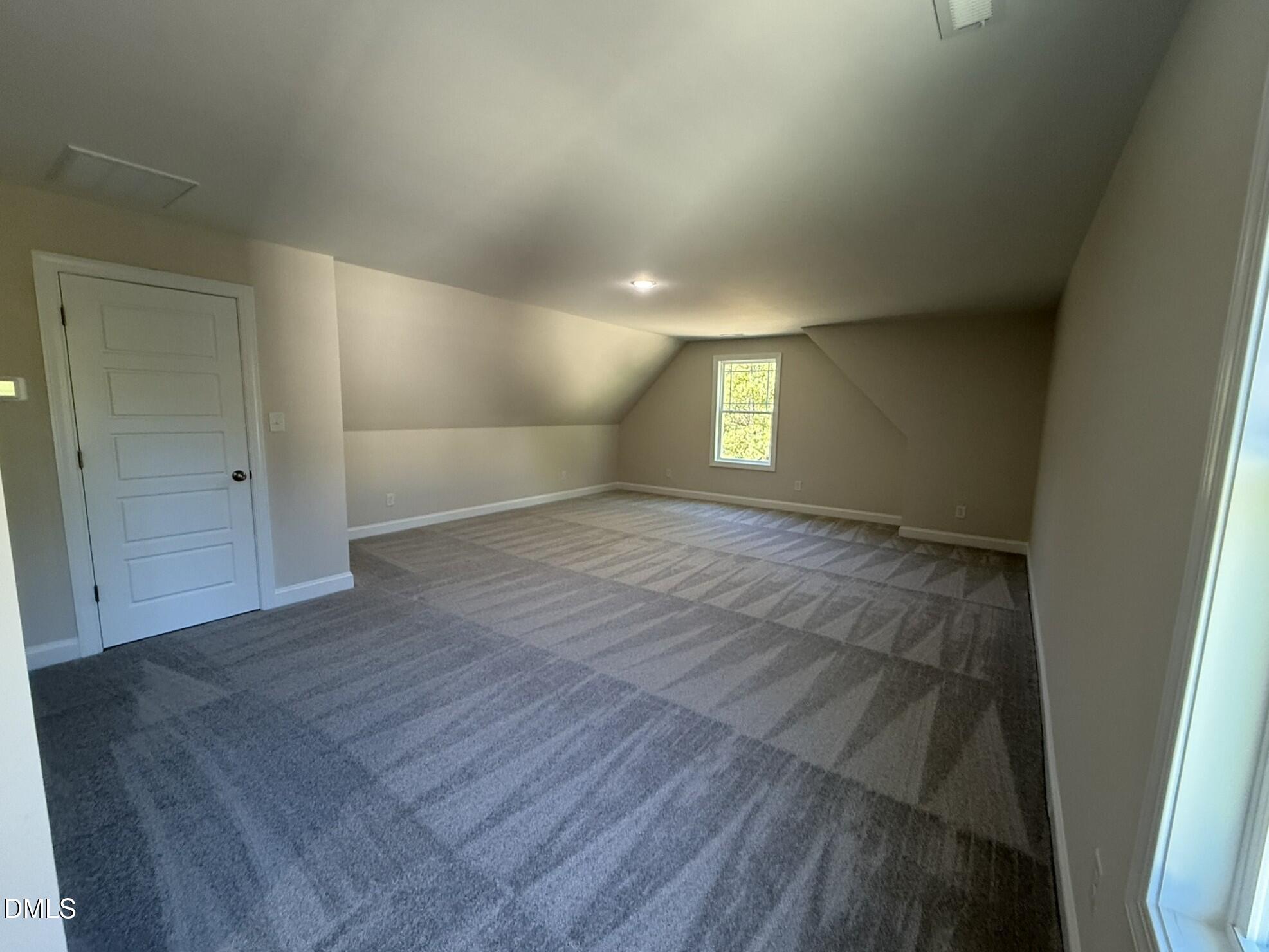 309 Busterfield Court Benson, NC 27504 - Photo 22 of 27 wooden floor in an empty room with a window