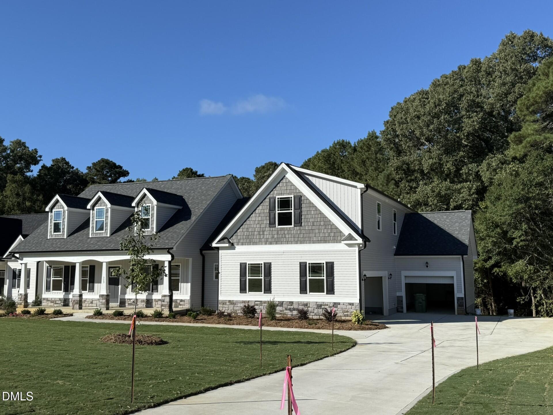309 Busterfield Court Benson, NC 27504 - Photo 3 of 27 a front view of a house with a yard