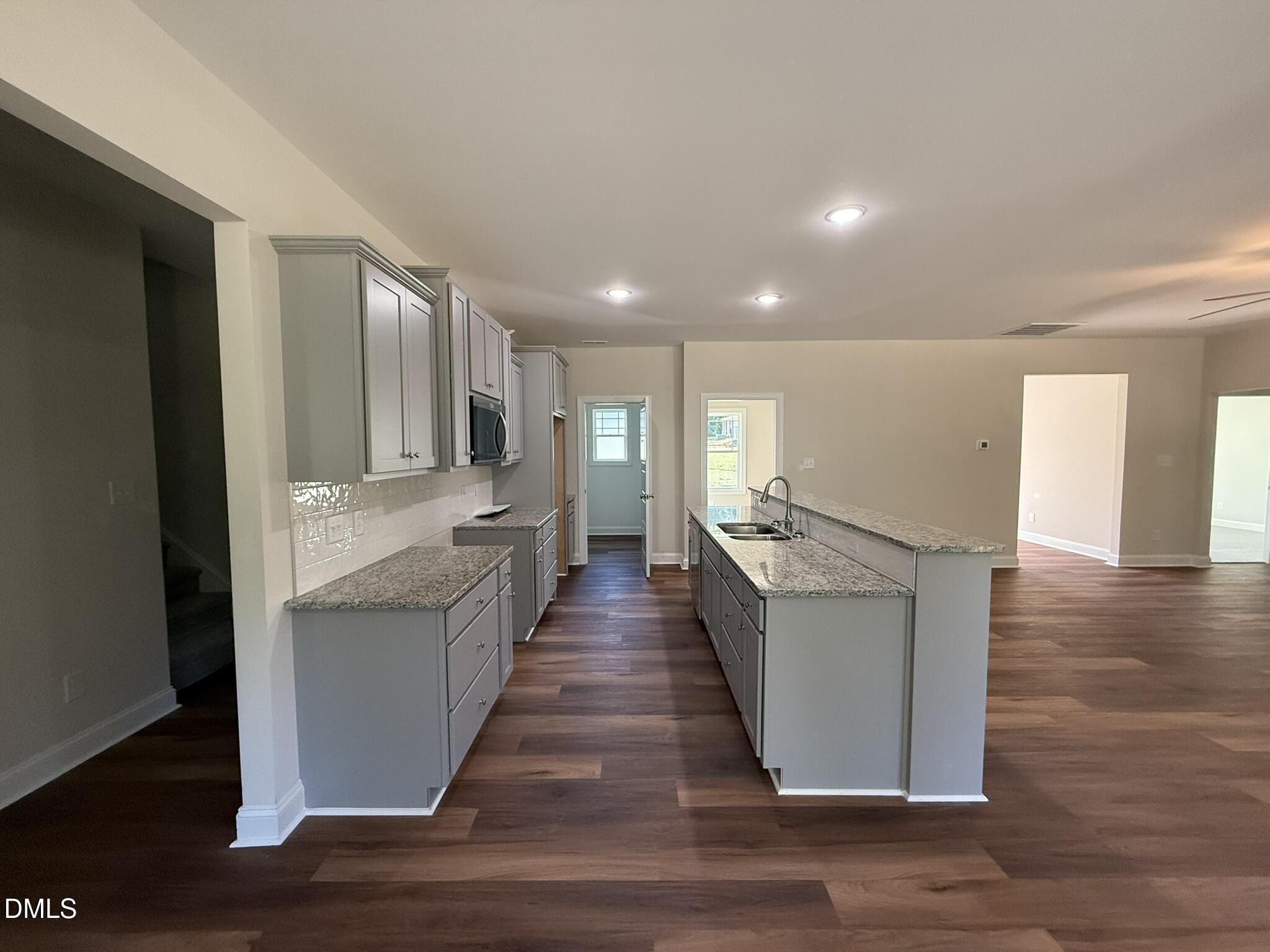309 Busterfield Court Benson, NC 27504 - Photo 10 of 27 a view of a living room with wooden floor