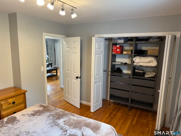 a bedroom with a bed and a closet