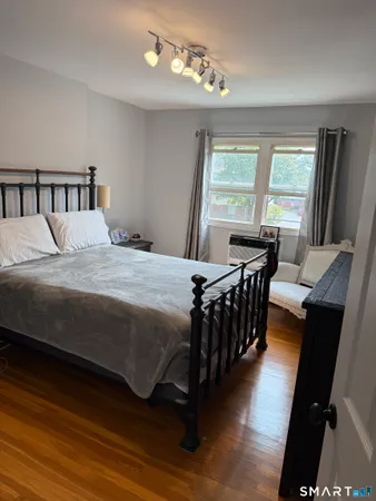 a bedroom with a bed and a table