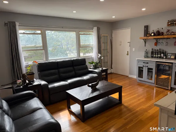 a living room with furniture and a large window