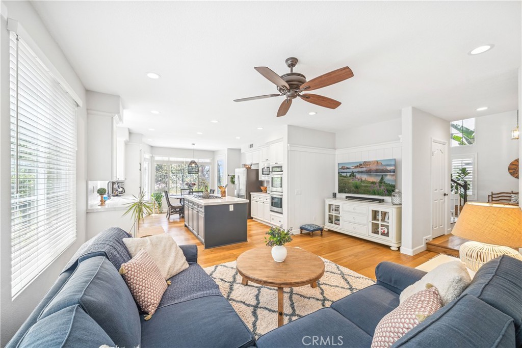 22681 Maplewood Mission Viejo, CA 92692 - Photo 11 of 71 a living room with furniture a large window with kitchen view