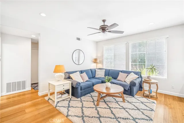 a view of a dining room with furniture and a potted plant