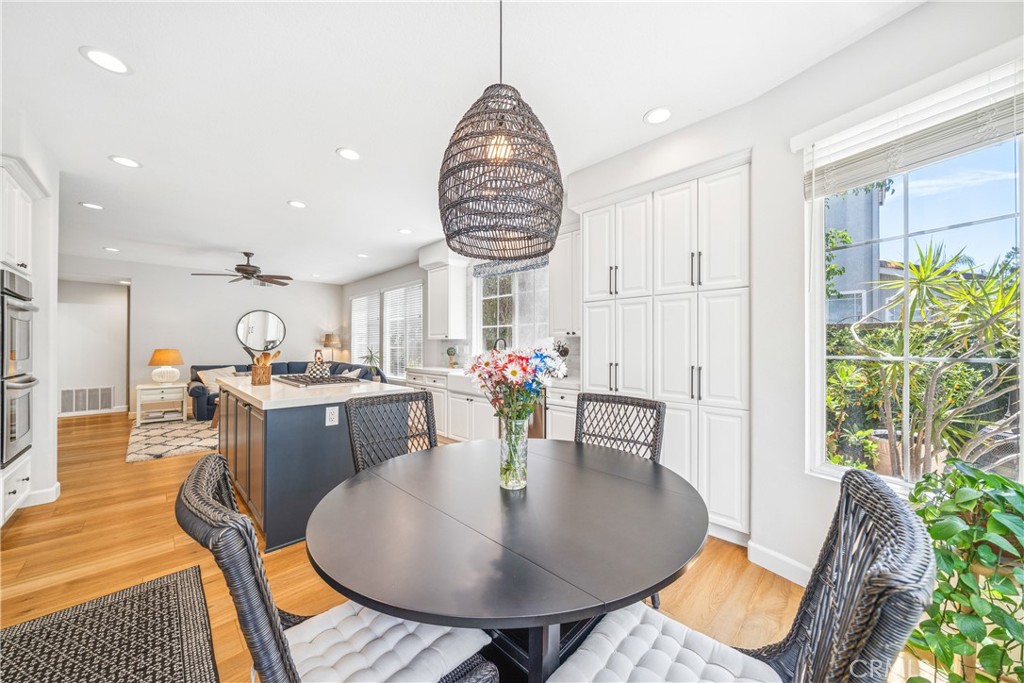 22681 Maplewood Mission Viejo, CA 92692 - Photo 19 of 71 a view of a dining room with furniture and a potted plant