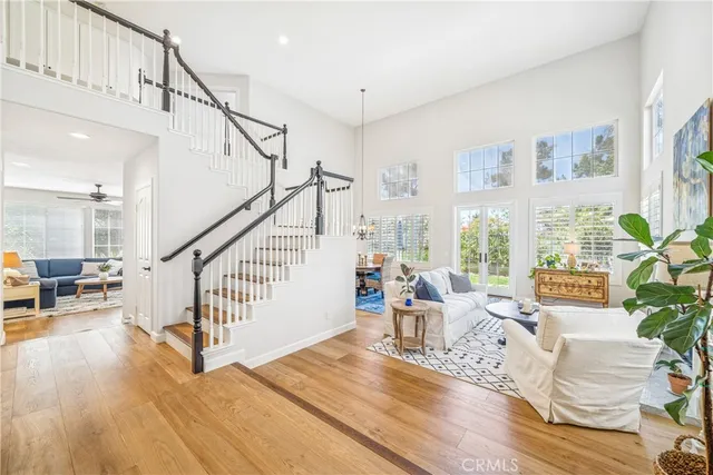 a view of entryway livingroom and hall with wooden floor