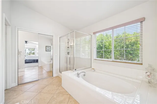 a bathroom with a double vanity sink and mirror