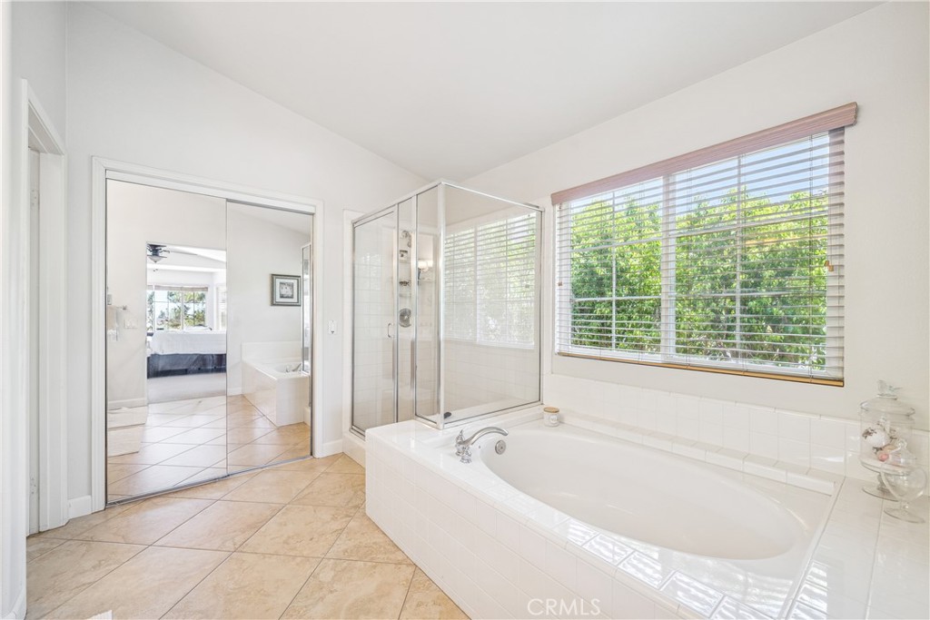 22681 Maplewood Mission Viejo, CA 92692 - Photo 27 of 71 a bathroom with a bathtub and a shower