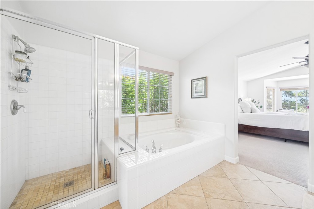 22681 Maplewood Mission Viejo, CA 92692 - Photo 29 of 71 a bathroom with a bathtub and a shower